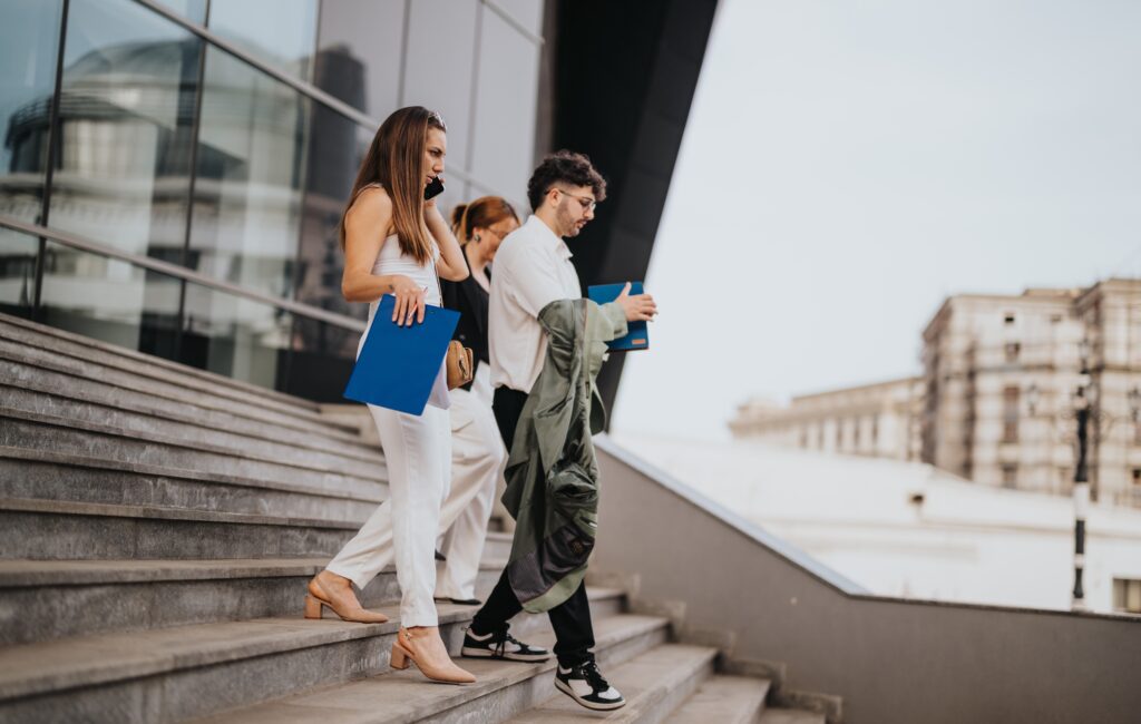 A door-to-door sales team walking down the stairs.